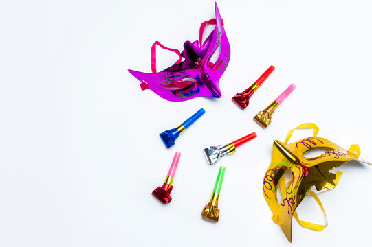Carnival masks and party blowers celebrating festive event