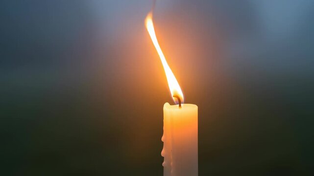 Single Burning Candle with Soft Flame and Blurred Background, Symbolizing Light, Hope, and Spiritual Reflection for Imbolc Celebrations