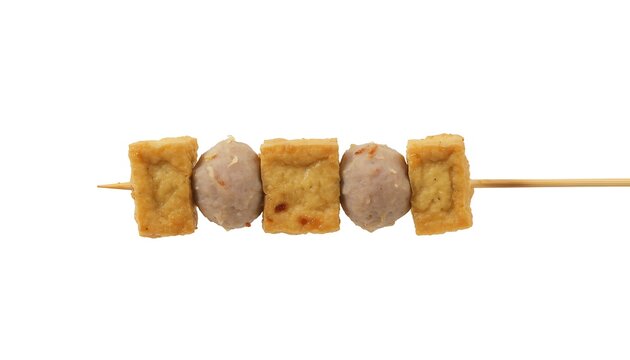 Sate cilok tahu served on a stick with tofu and meatballs, close-up shot