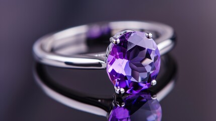 Elegant Amethyst Ring with Silver Band and Reflection on Dark Background in Studio Setting