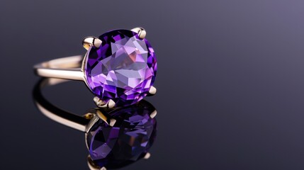 Elegant Purple Amethyst Ring with Gold Band on a Dark Reflective Surface
