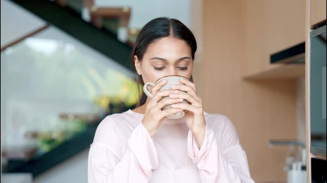 Close Up Portrait of Relaxed Woman Holding Mug and Enjoying Aroma of Fresh Hot Coffee. One Young Female Before Taking Sip in Kitchen Interior Today In Morning Slow Motion 4k