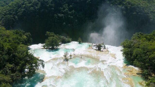 Explore Cascada de Tamul in Huasteca Potosina, San Luis Potosi, Mexico with stunning views of waterfalls and tropical vegetation
