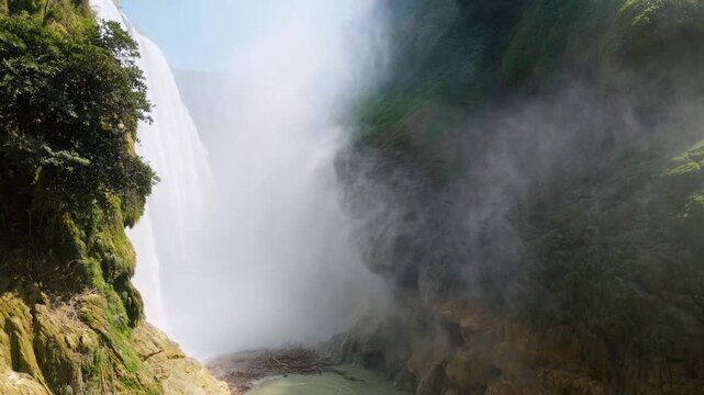 Visit Cascada de Tamul in Huasteca Potosina, Mexico with its high waterfall and lush tropical vegetation
