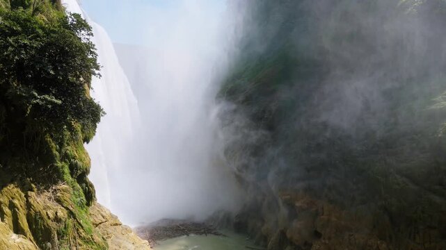 Discover Cascada de Tamul in Huasteca Potosina, explore the natural water flow and tropical setting