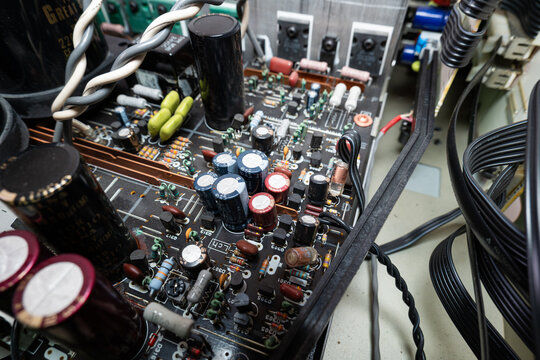Internal view of complex electronic circuit board. Top down, close up, old power amplifier board