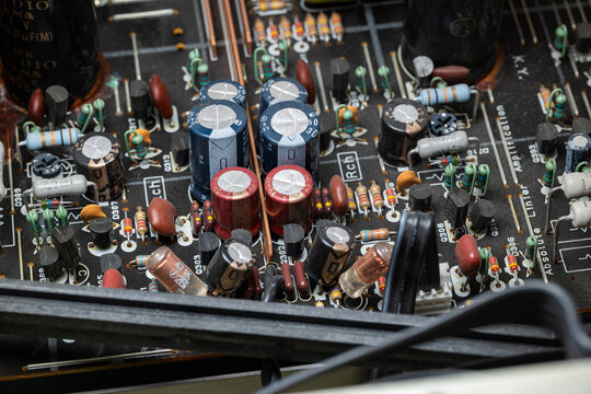 Internal view of complex electronic circuit board. Top down, close up, old power amplifier board