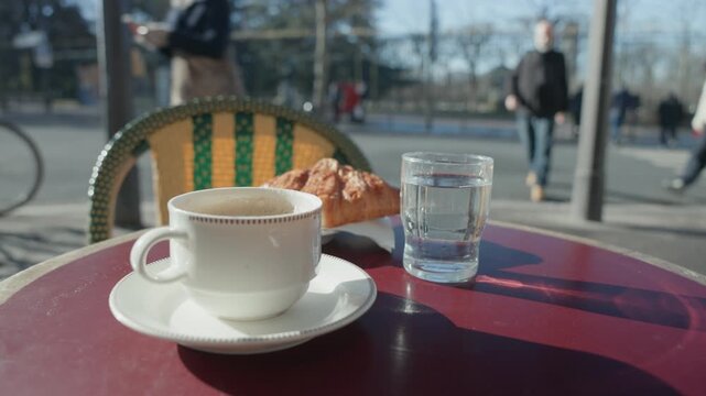 Sunny Morning Still Life of Breakfast with Coffee, Croissant, and Water