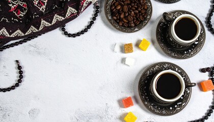 Coffee, beads, sugar cubes, and patterned fabric on table