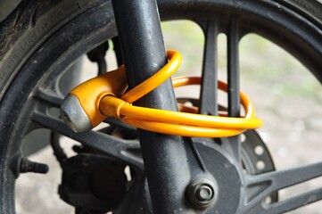 Close Up of Motorcycle Wheel Lock for Security Protection