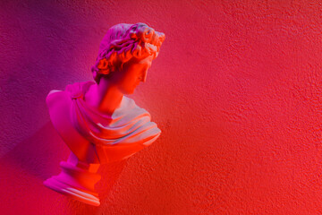 Neon Pink Red Gradient Classical Apollo Bust Sculpture on Textured Wall Copy Space