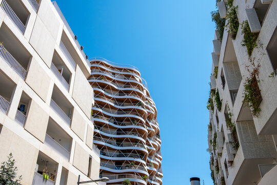 Modern apartment architecture from a courtyard perspective with balcony in Port Marianne Montpellier France captured in blue daylight tones