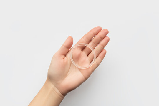 Woman's hand holding a contraceptive vaginal ring