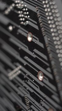 Computer Motherboard, Vertical Close Up of Back Board Solders