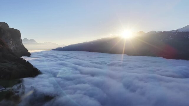 Sunrise over Walensee with misty mountains, serene and peaceful