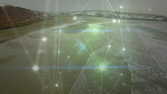 Coastal shoreline and glowing network pulsing and sliding as drone tracking forward mapping coast
