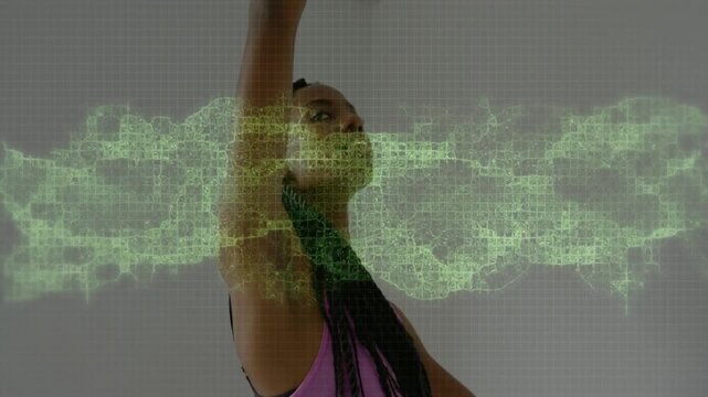 Dancer lifting and rotating, causing green band overlaying upper body and face, showing performance