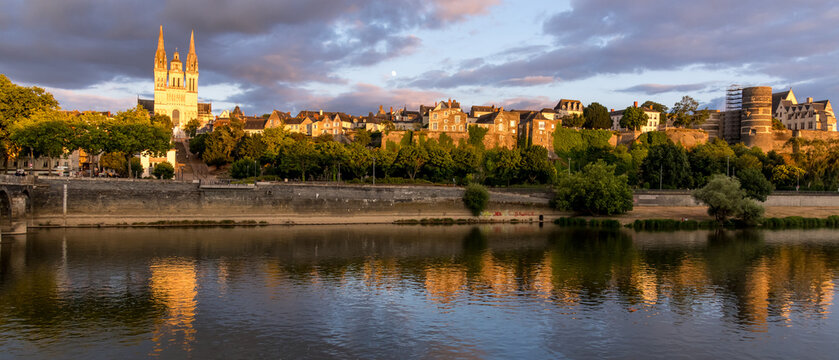 Sunset scenery in beautiful city of Angers in France, with famous chateau and cathedral