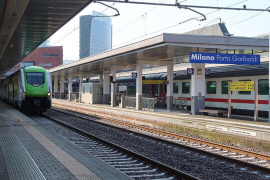 Milano Porta Garibaldi Station with a green train in Milan, Italy. May 21, 2025