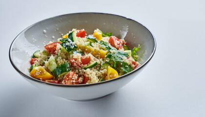 Colorful Fresh Salad in White Bowl with Mixed Vegetables.