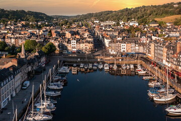 Obraz premium Aerial view with unset scenery in beautiful town of Honfleur in France with a little harbor 