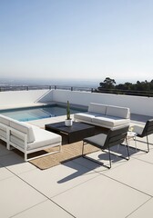 Fototapeta premium Modern outdoor living space with pool, views and designer furniture