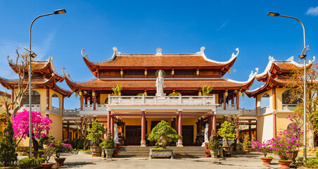 Entrance of the Chua Hue Chieu temple in Kontum, Vietnam. Panorama © Olga Khoroshunova