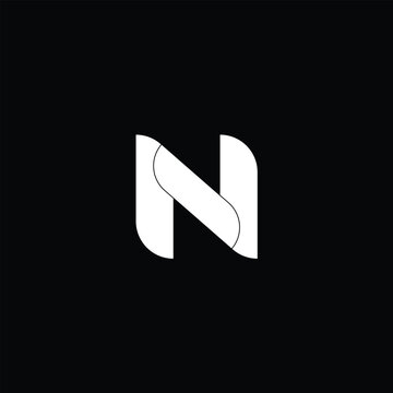 Modern abstract N letter monogram logo featuring flowing curved overlapping shapes aligned with 2025 design trends where personalized monograms infused with character and custom quirks