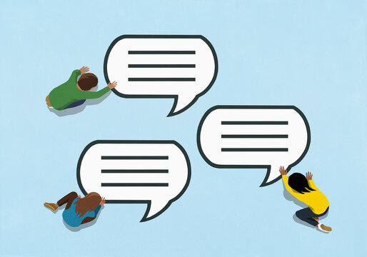 View from above of teenagers touching speech bubbles on blue background