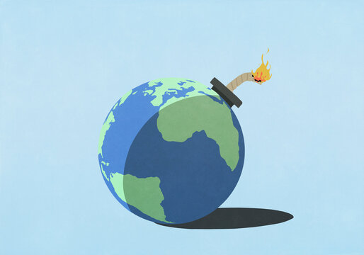 Globe bomb with ignited fuse on blue background