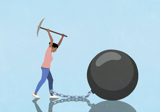 Woman with pickaxe breaking chain connecting her ankle to large bomb on blue background