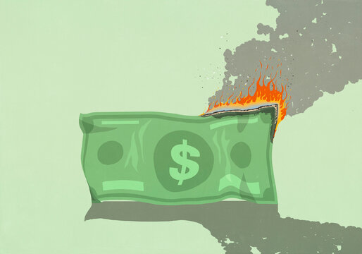 Large U.S. dollar bill burning on green background