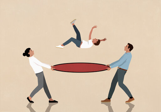 Parents holding safety net under falling son