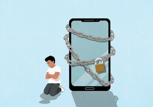 Angry boy with arms crossed next to large padlocked smart phone