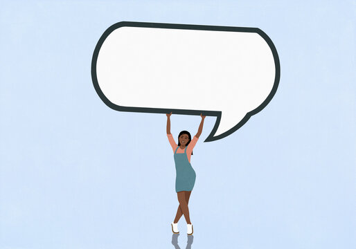 Portrait of teenage girl holding large speech bubble overhead