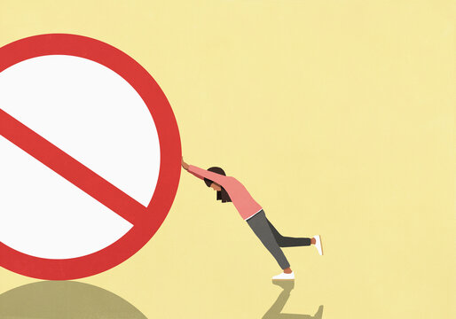 Woman pushing large round no symbol against yellow background