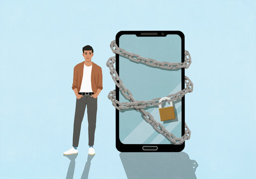 Young man standing next to large padlocked smart phone
