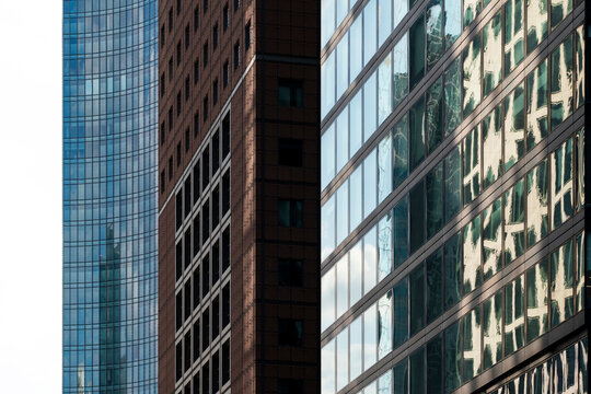 Abstract urban architecture in Frankfurt Germany shows skyscraper glass facade with repeating pattern and sharp reflection for modern city design