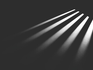 Abstract black and white image with light beams emanating from upper right