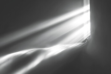 Abstract dark image with light streams, shadow, and textured surfaces