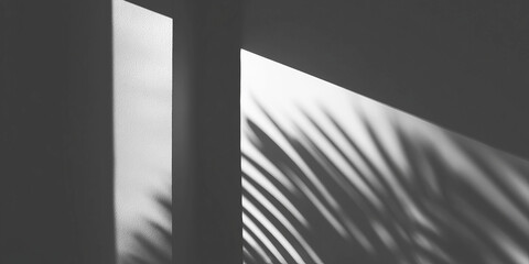 Shadows of leaves cast on a textured surface with dark, abstract background