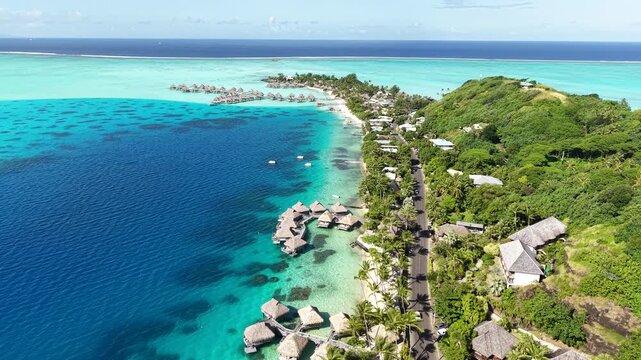 Drone Shot of Bora Bora Island, French Polynesia, Matira Beach and Luxury Tropical Resort With Villas Over Water