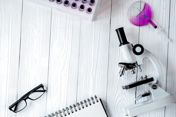 doctor workplace at wooden table in lab top view