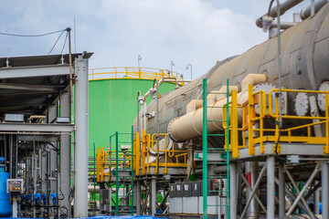Demineralized water tank and multi effect desalination plant (MED) at industrial power plant. A thermal technology uses steam to produce distilate water from seawater