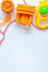 cooking mashed carrots for baby on white background top view