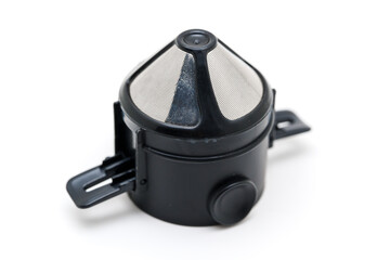 Coffee and tea brewing filter in a mug on a table