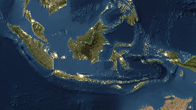 Satellite view of Indonesia and surrounding countries shows city lights at night from space.
