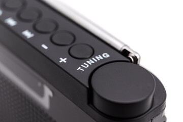 Radio receiver shows tuning knob and buttons for adjustment