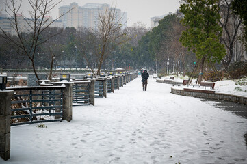 Snowfall on Lakeside Park Walkway in Wuhan, China