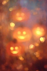 Obraz premium Abstract Halloween background with glowing bokeh jack o lantern lights.